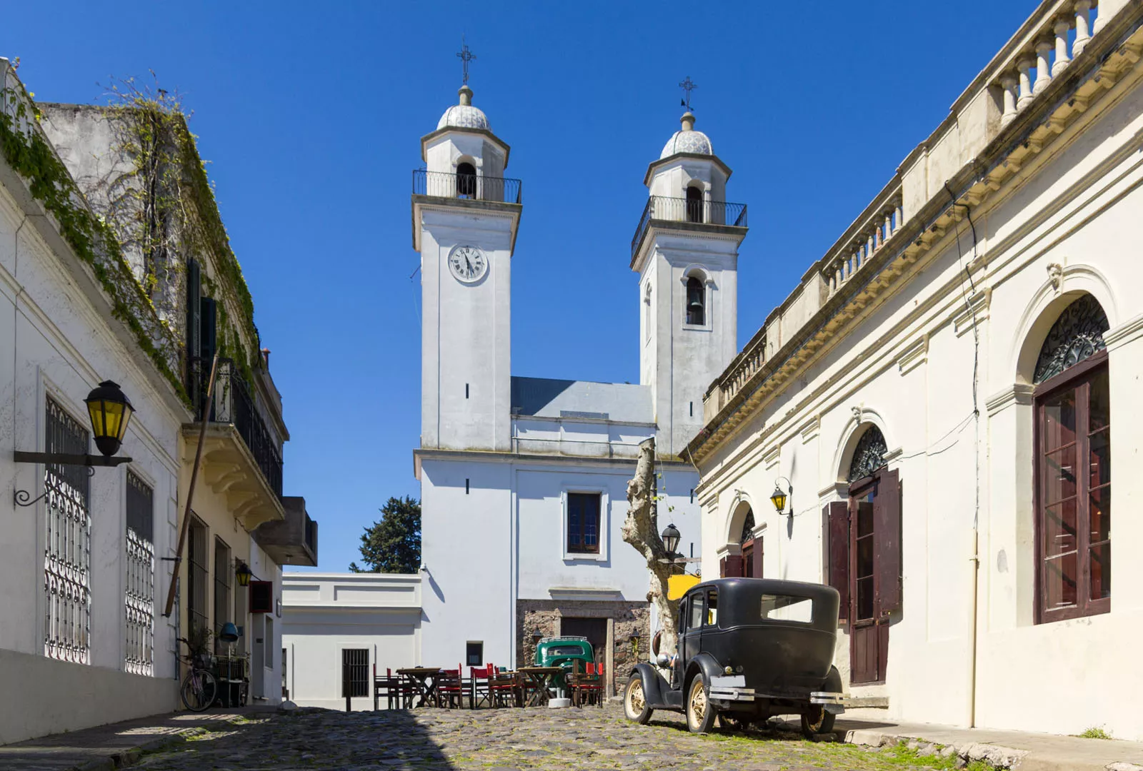 Stone pathway leading to a large, white church building