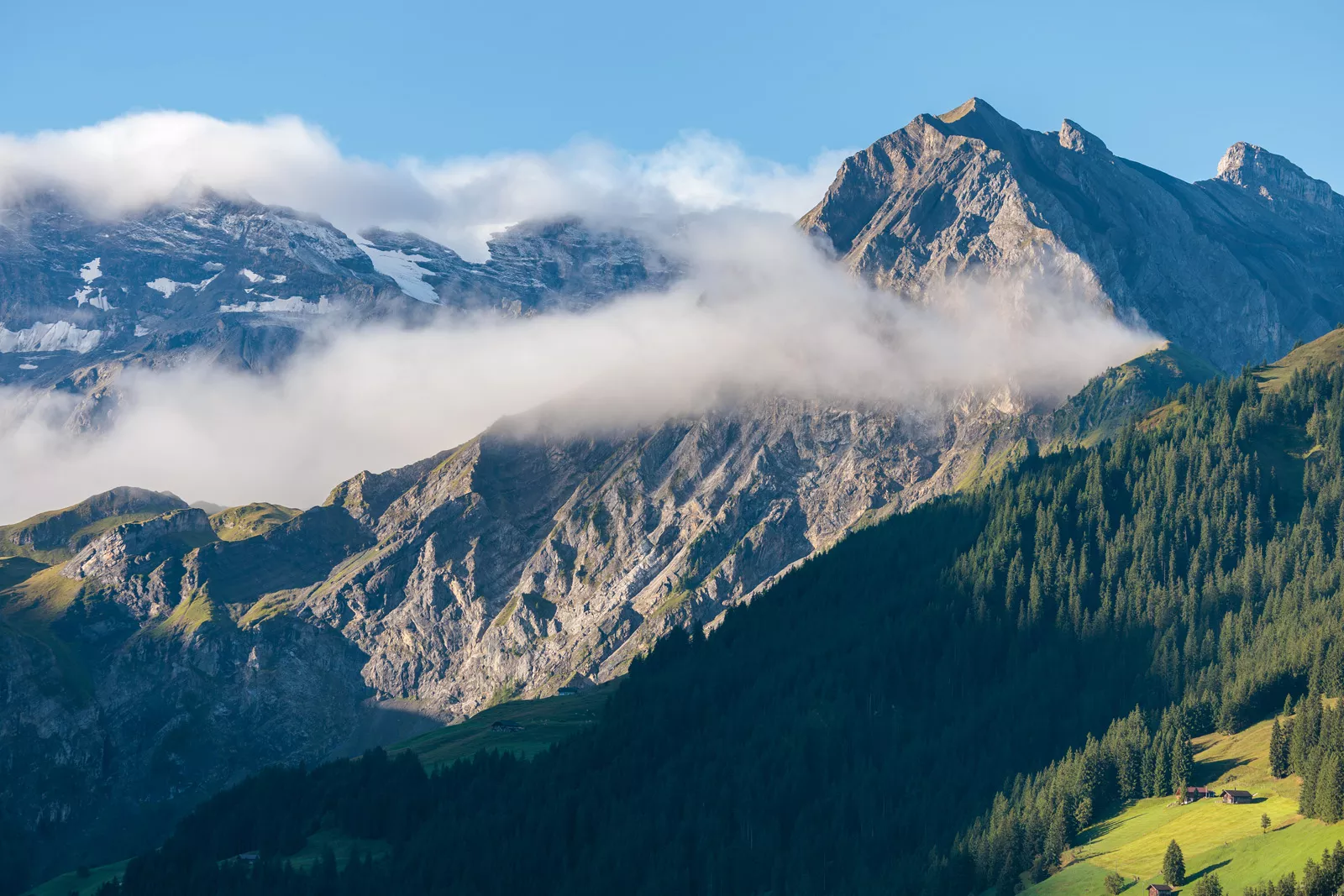 mountain with clouds flying by
