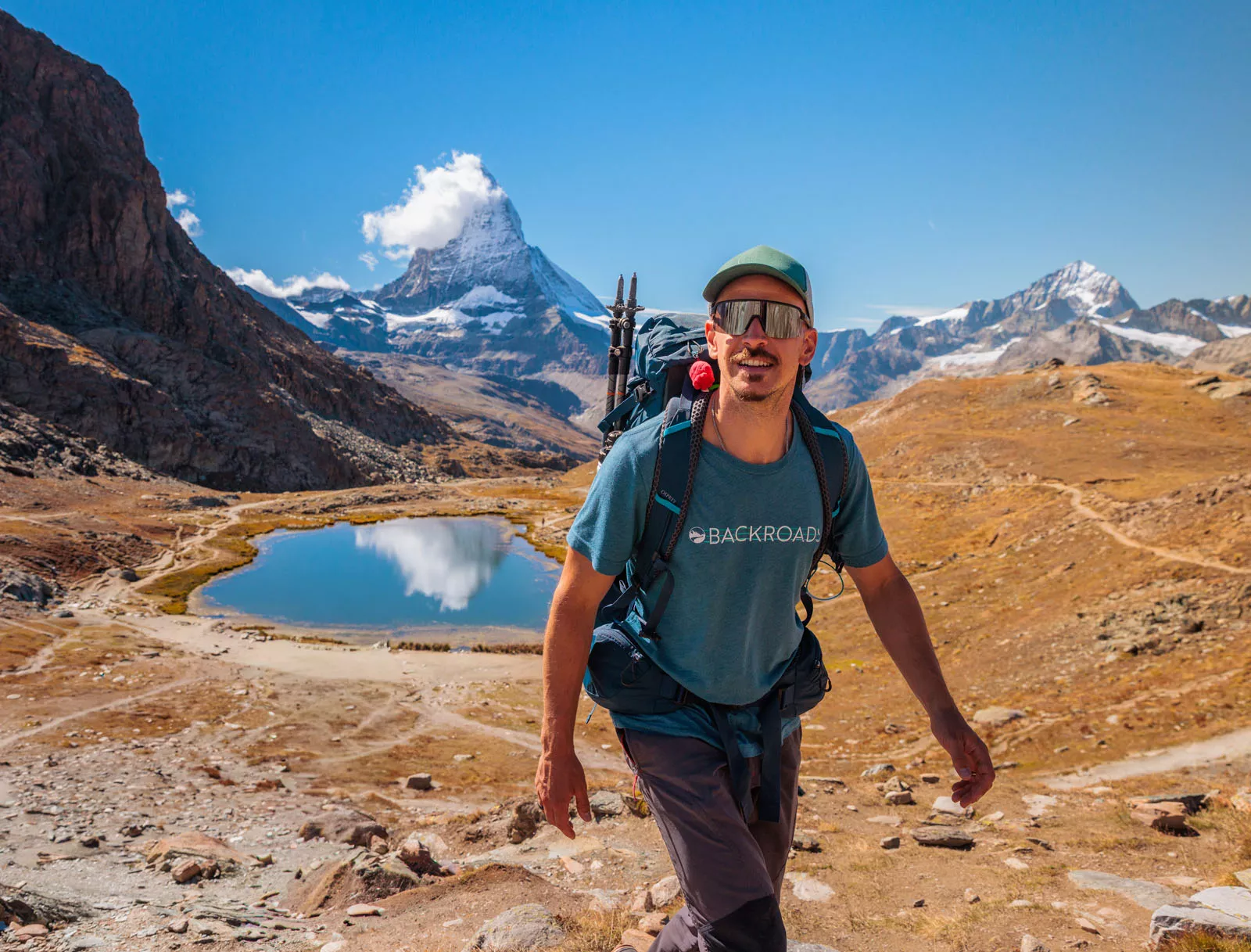 Backroads guest on hike with lake in background
