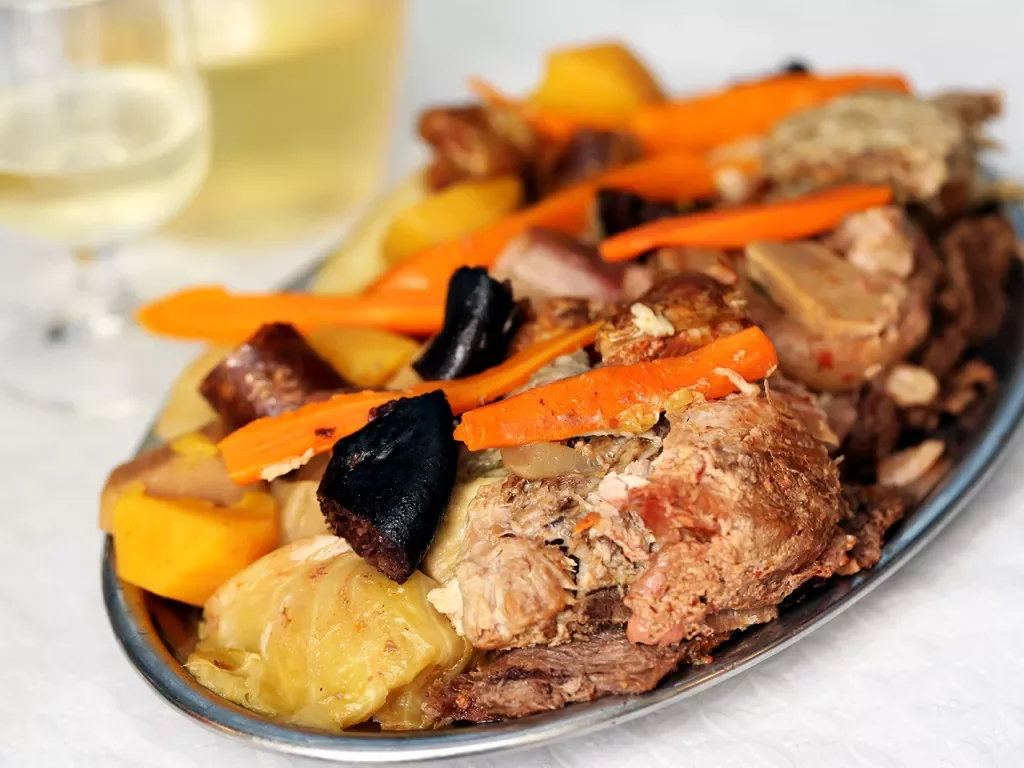 Traditional Portuguese dishes, the Azores, the region Furnas .Switch in restaurants, cooked in boilers The various types of meat and cabbage with potatoes and carrots.