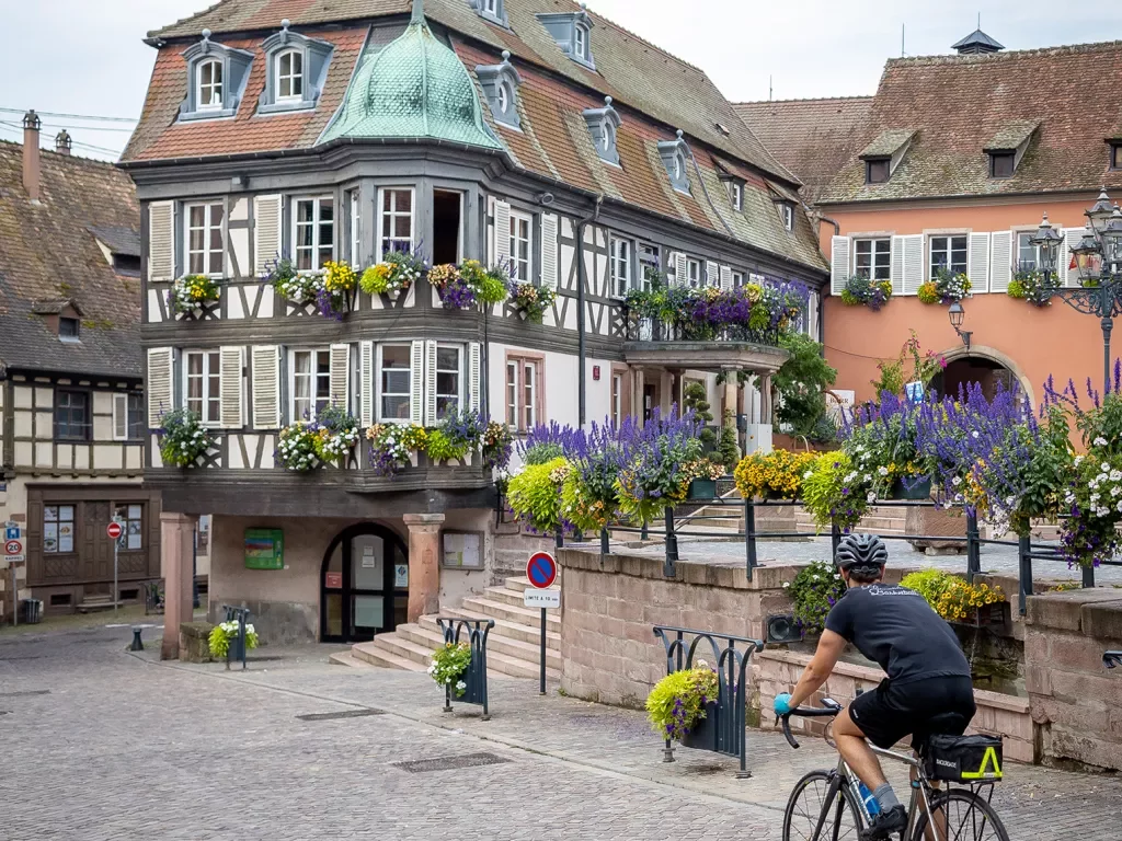 Backroads Guest Biking Through a Town in Alsace
