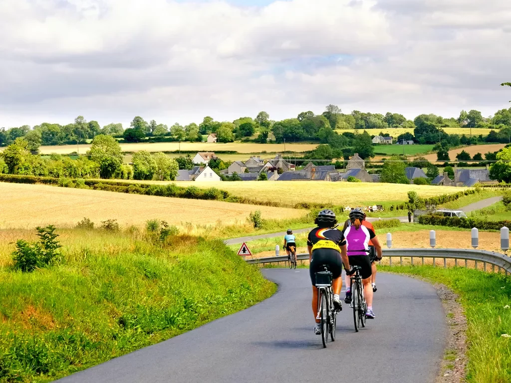 Cyclists riding through countryside