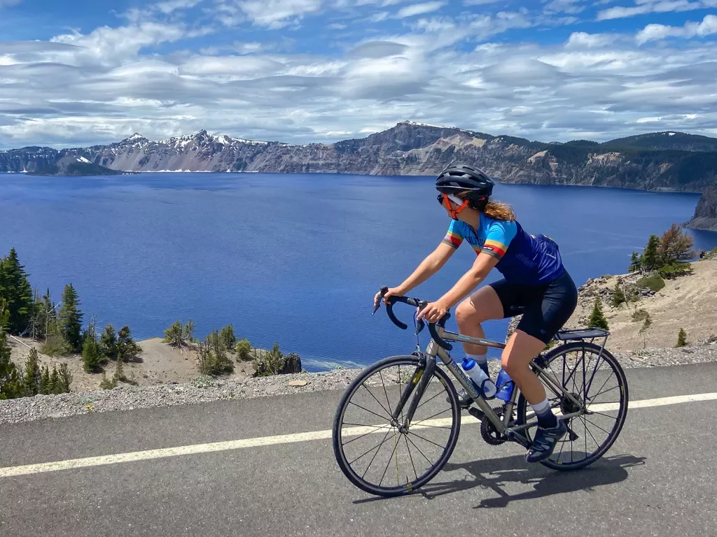 Guest cycling past Crater Lake.