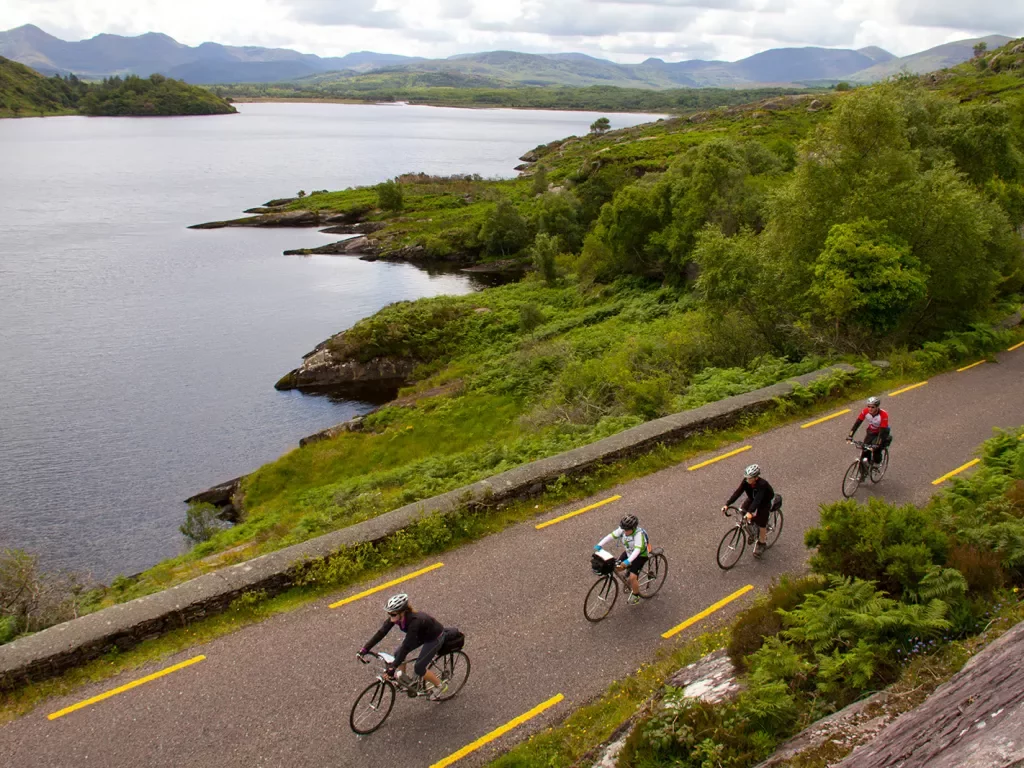 Four Cyclist Ride Along Lake Ireland
