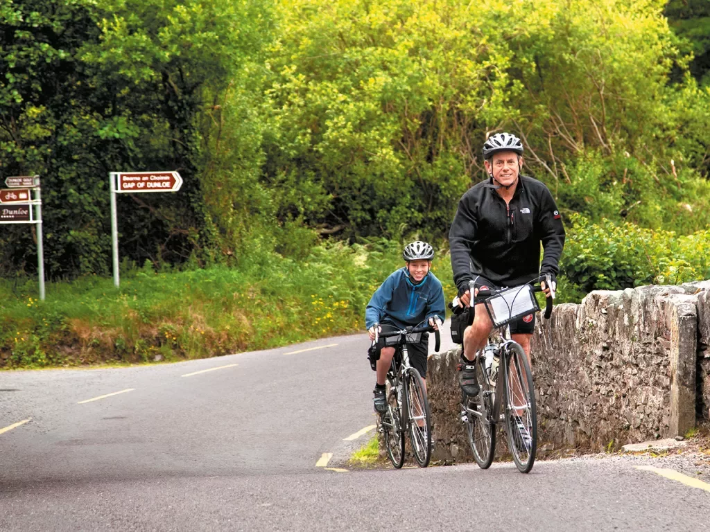 Father Son Riding Up Hill Ireland