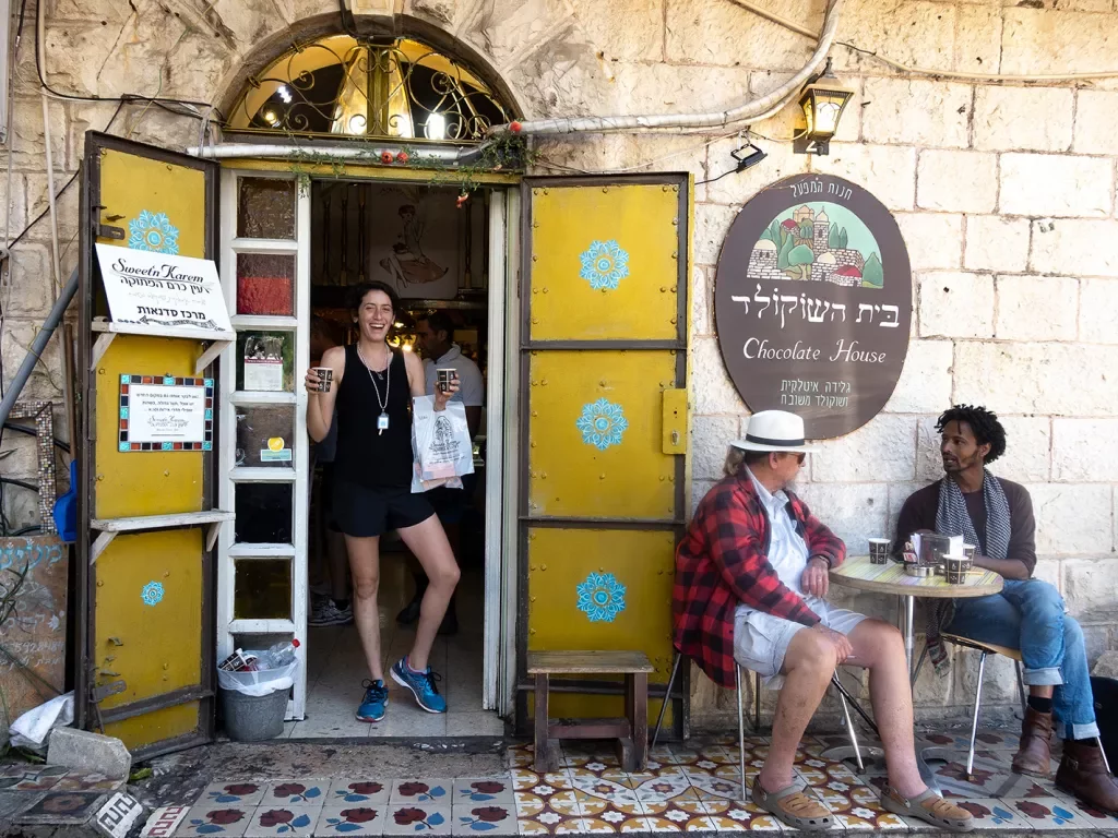 Woman exiting chocolate shop in Jerusalem