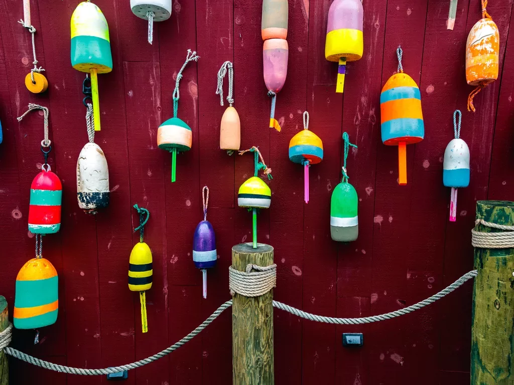 Wall of different colored buoys.