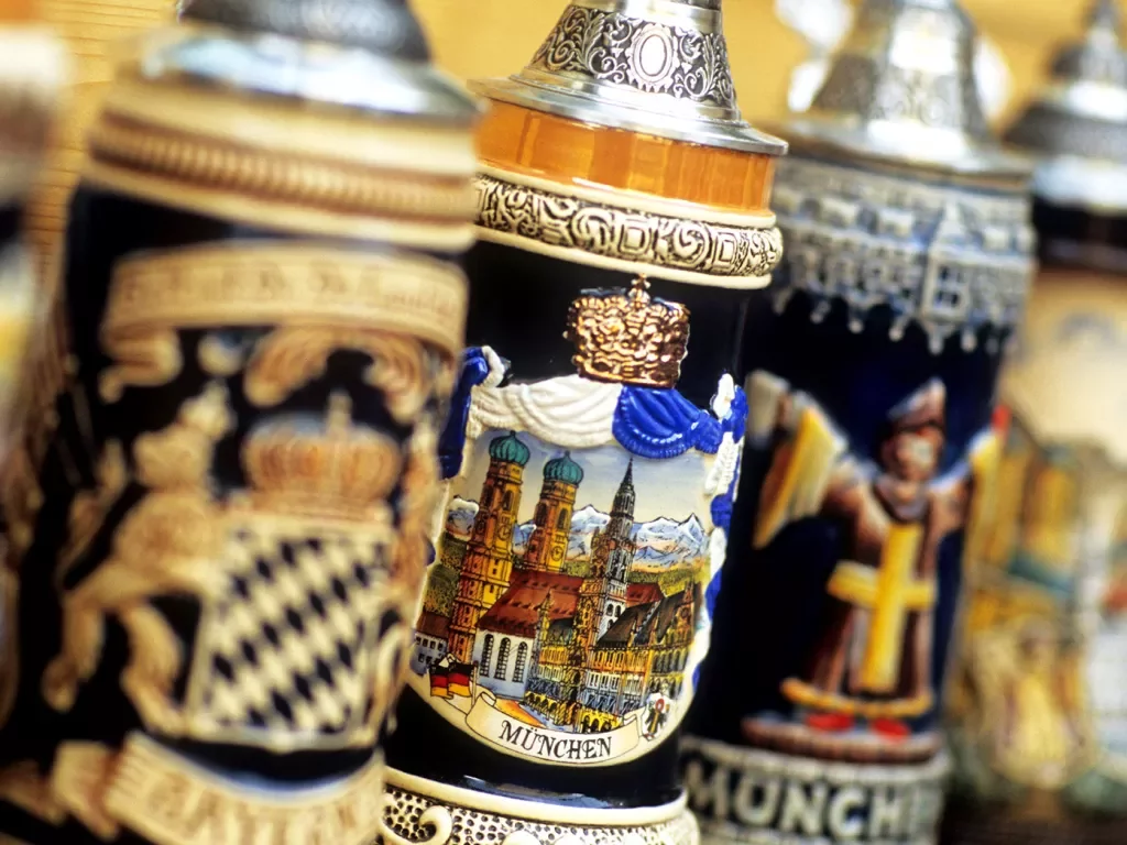 Ceramic beer steins in a row.