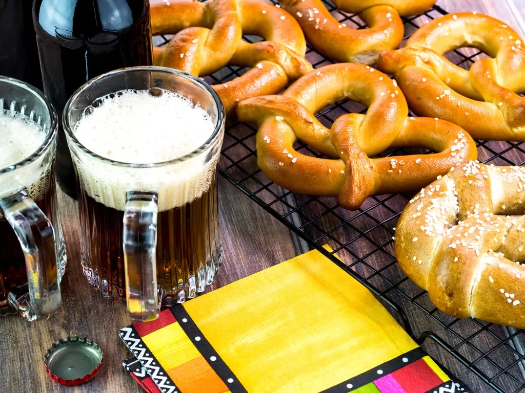 Glasses of beer and soft pretzels.