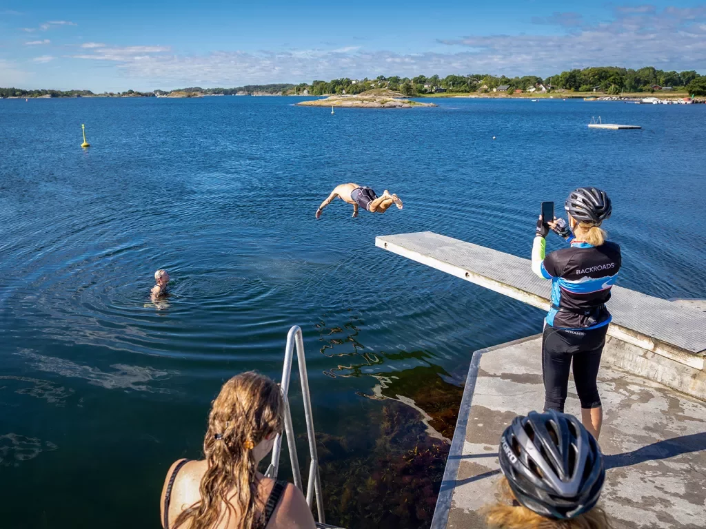 Guests diving into a river in Norway