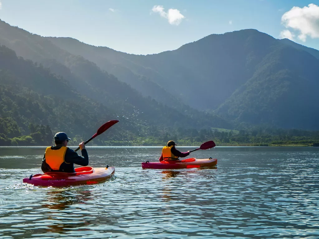 Asia & Pacific Kayaking on River with Mountain View