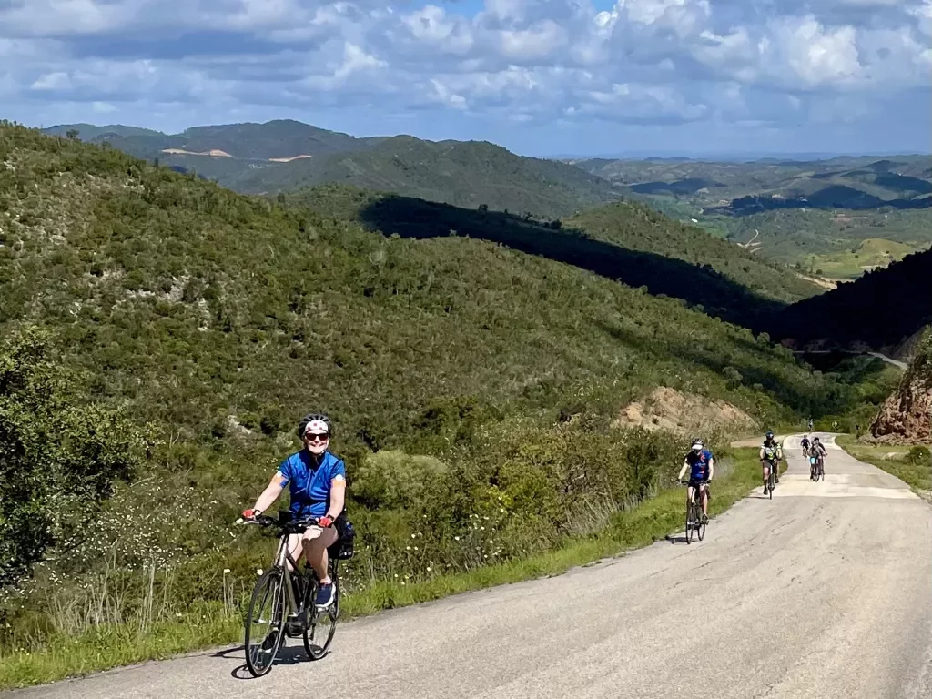 Backroads guests biking uphill in Portugal.