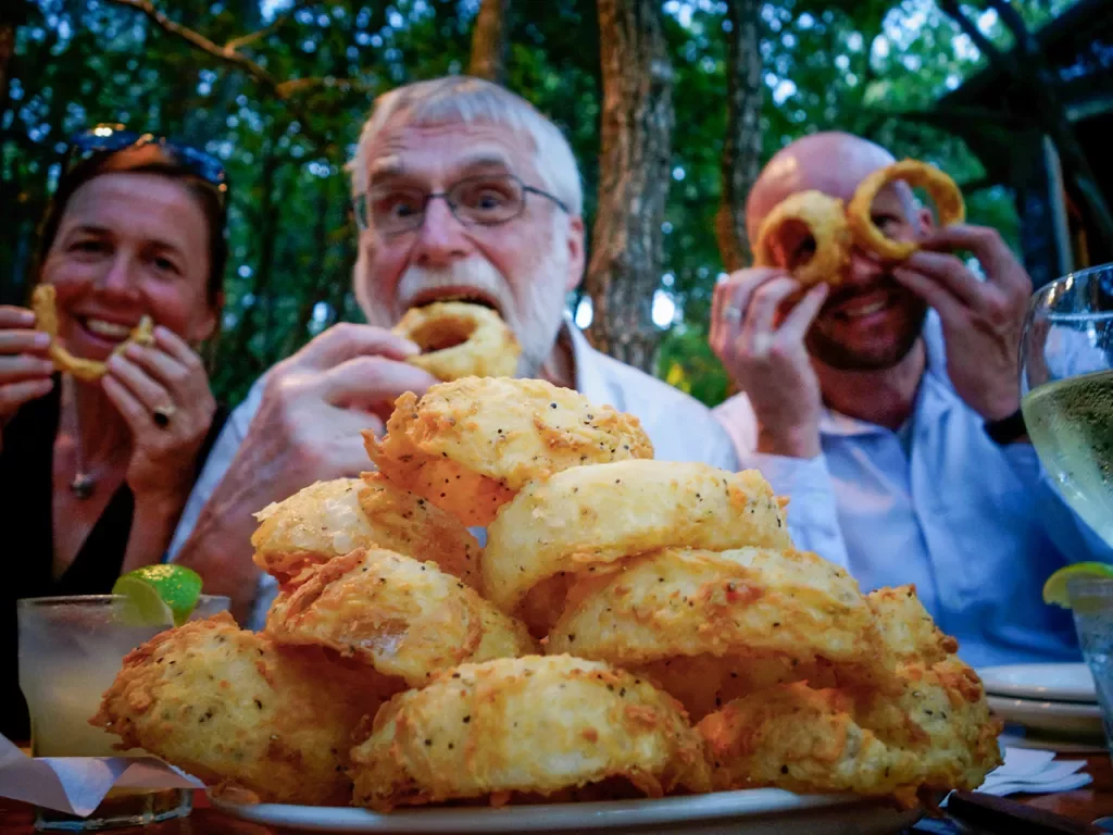 Backroads guests enjoying onions rings and company