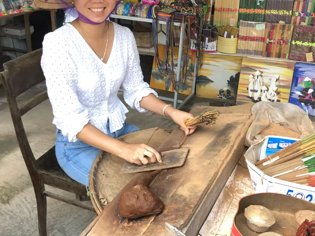 Local Vietnamese woman preparing food