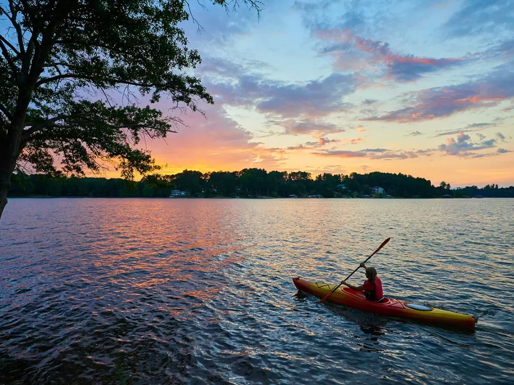 Wide shot of kayaking guest during sunset.