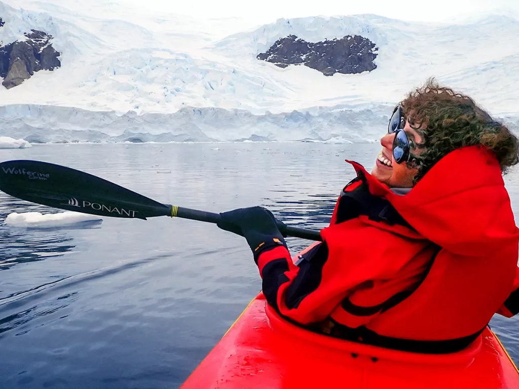 Person kayaking in the icy waters of Antarctica