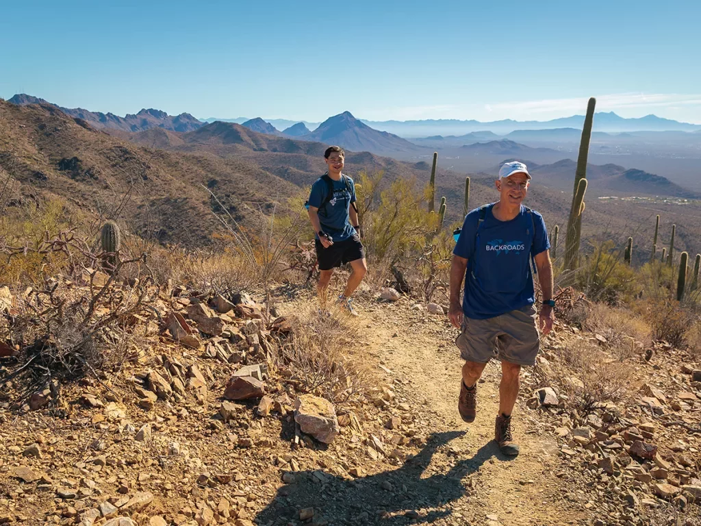 Man and boy hiking in desert AZ 
