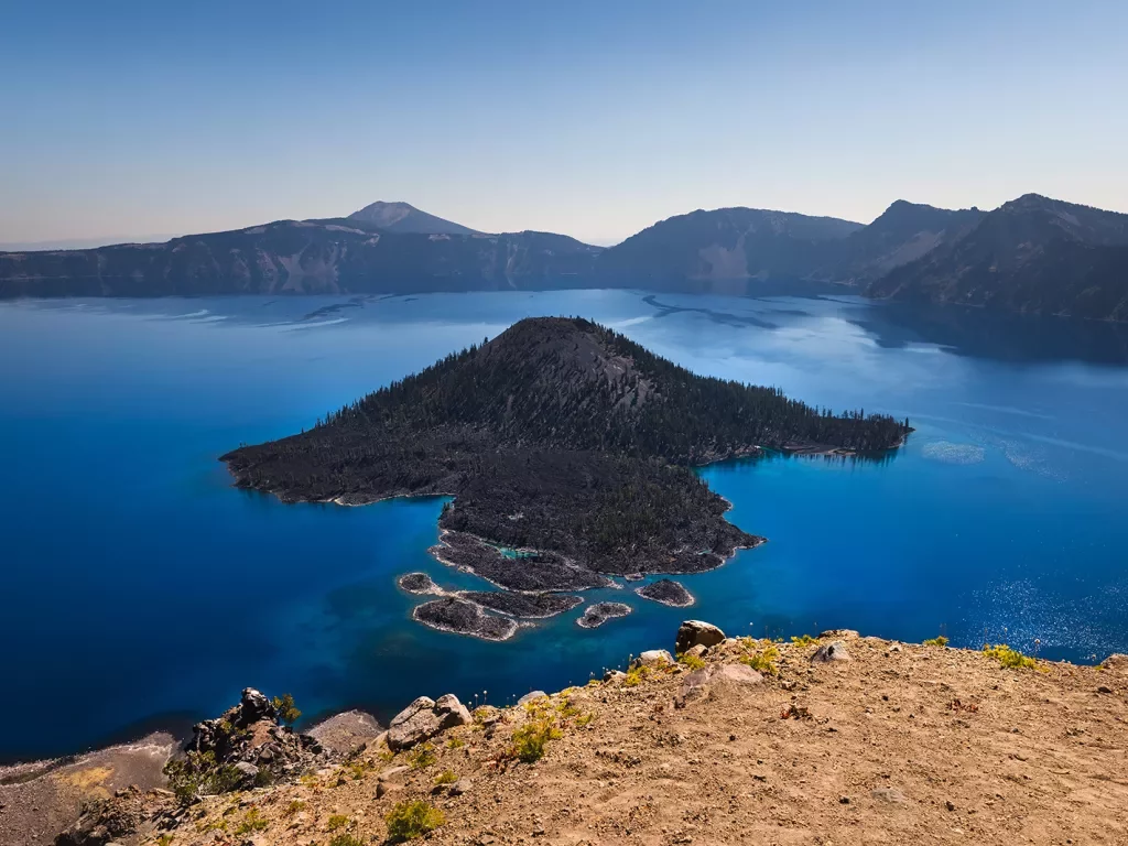 Wide shot of Wizard Island in Crater Lake.