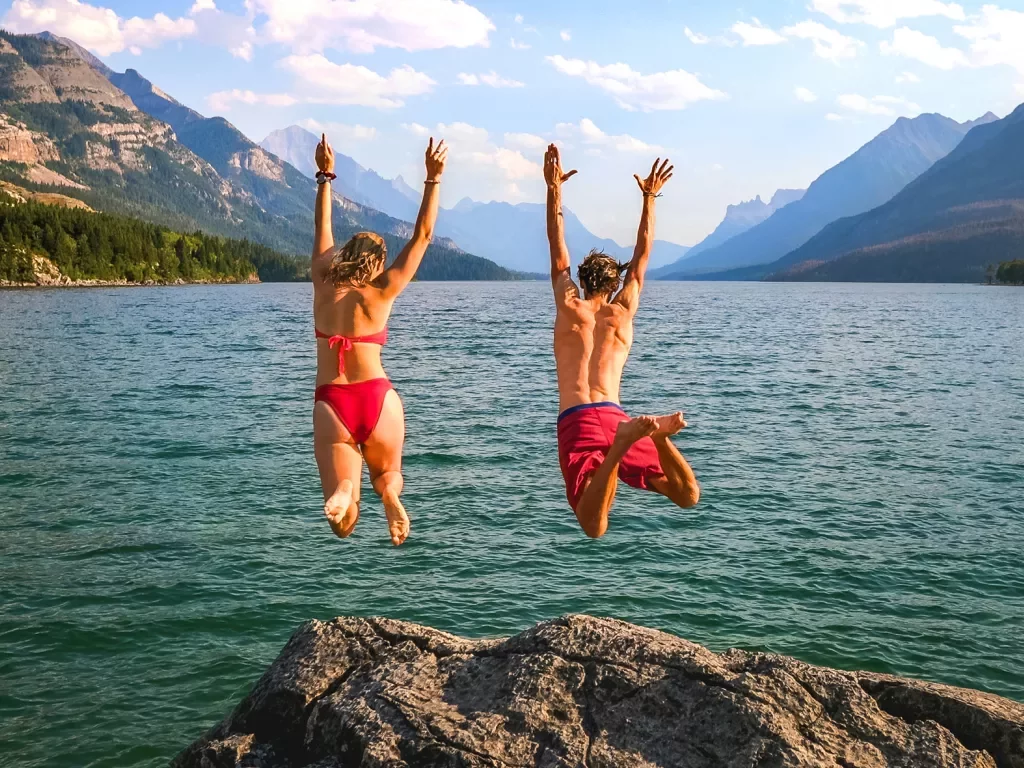 Backroads guests rock jumping into blue water