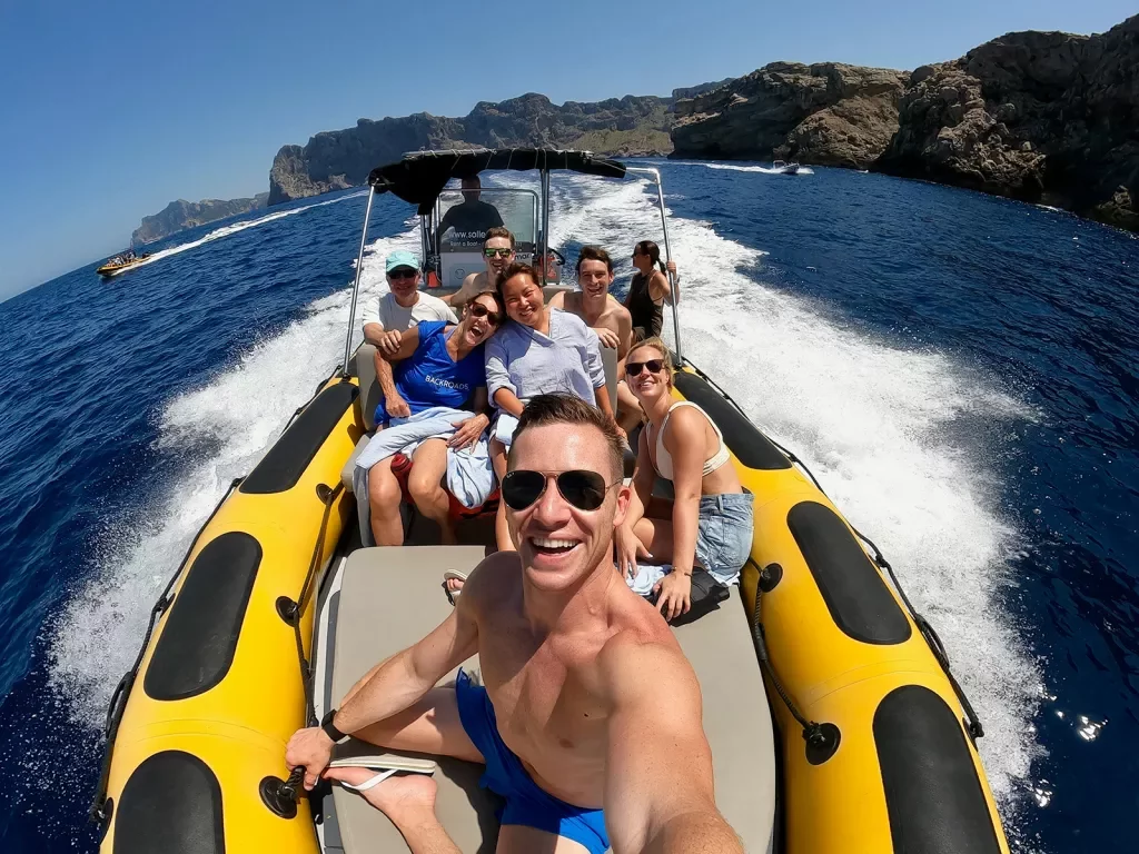 Selfie of guests on large, moving dinghy.