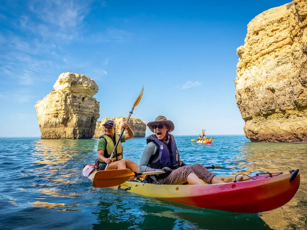 Kayaking among towering rocks in Portugal