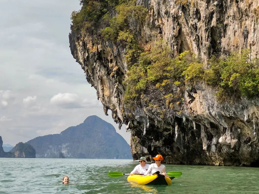 Kayaking in Thailand among large rock formations