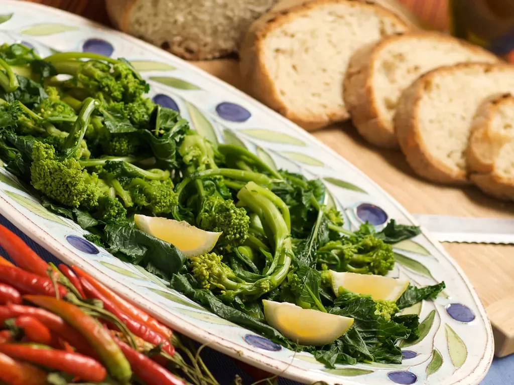 Platter of broccolini, chilis and bread.