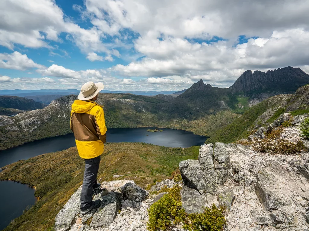 Hiker explores landscape of Marions lookout trail in Cradle Mountain National Park in Tasmania, Australia. 