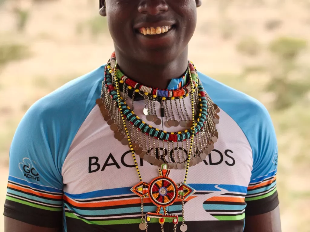 Backroads cyclist wearing traditional local jewelry
