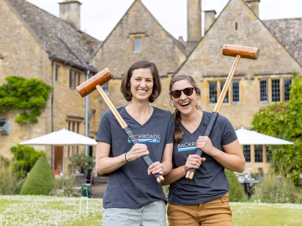 Two Backroads guests playing croquet in England.