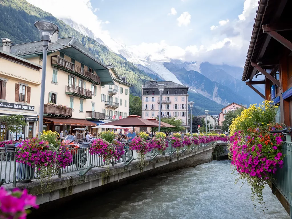 Shot of the Chamonix River, surrounded by storefronts.