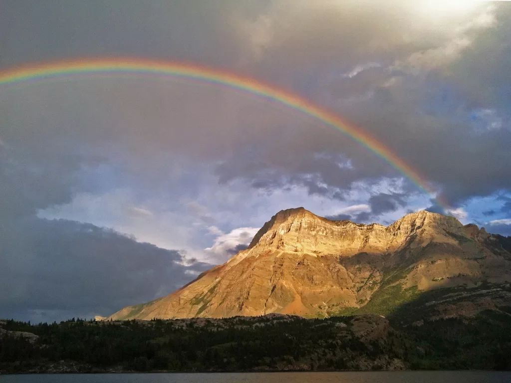 Rainbow stretching over mountain landscape