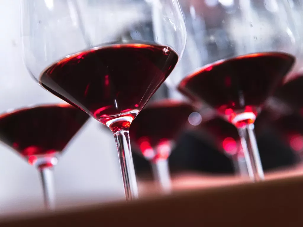 Close-up of red wine filled glasses.