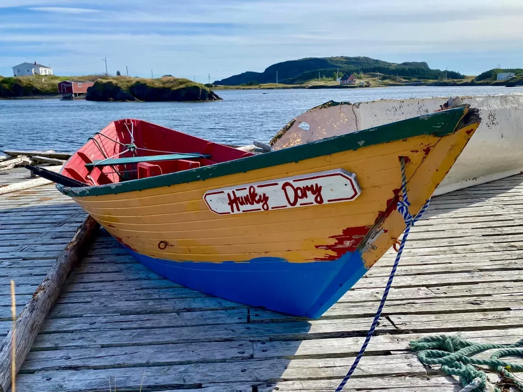 Close-up of small boat, the "HUNKY DORY", on a pier.