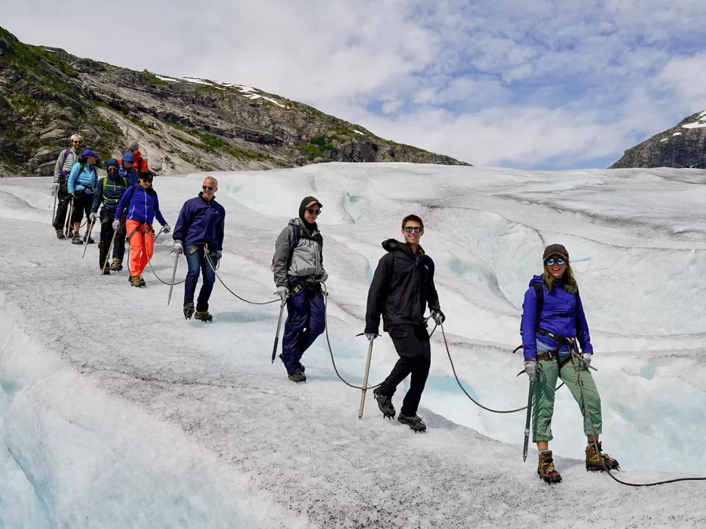 Walking along an icy glacier in Norway