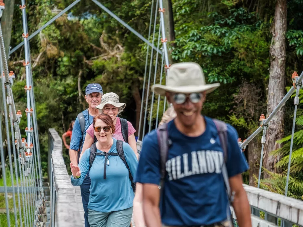 Hiking across a bridge in New Zealand