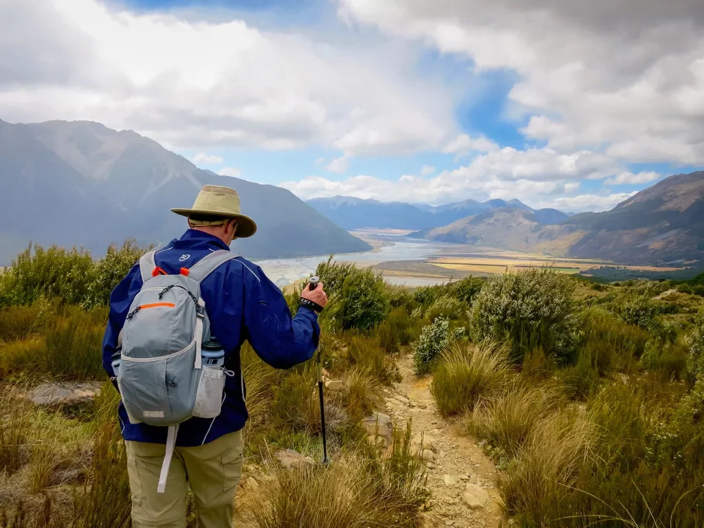 Guests hiking through a filed in New Zealand
