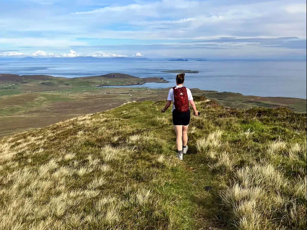Hiker in Scotland with coastal views 