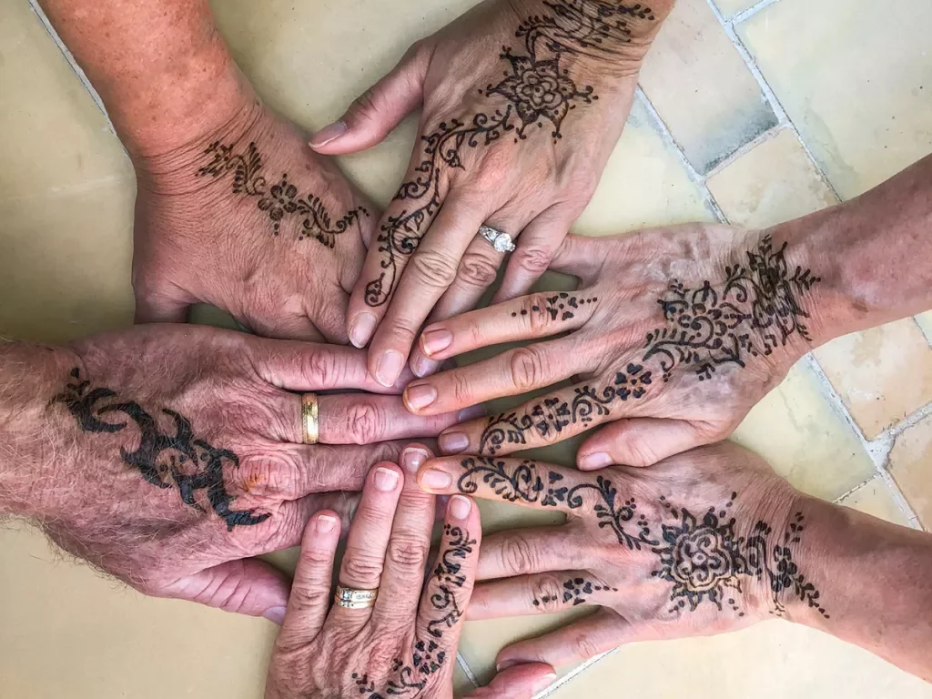 A group of hennaed hands