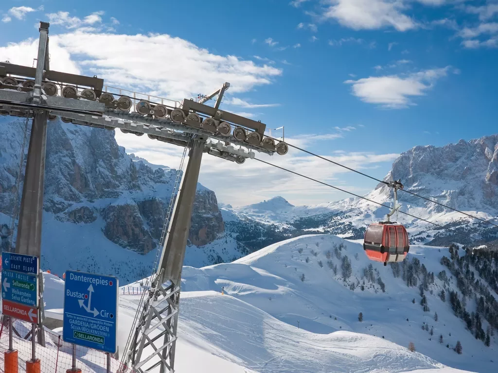 A gondola goes up a ski mountain