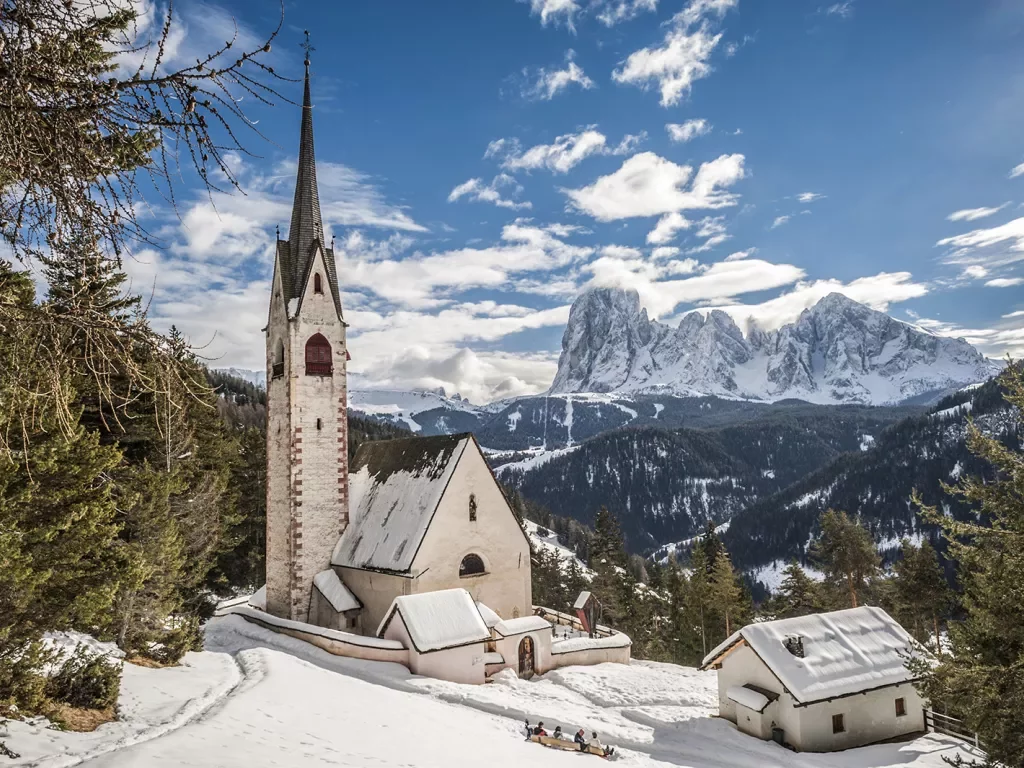 Snow covers a church