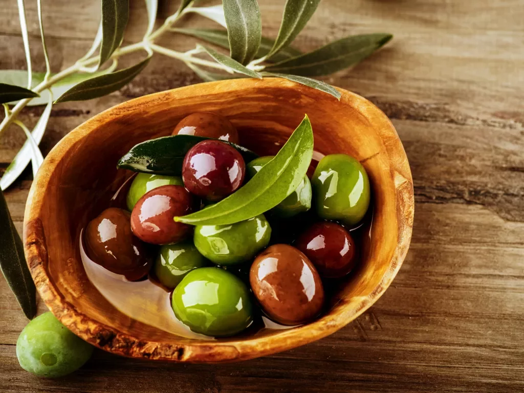 wooden bowl of olives