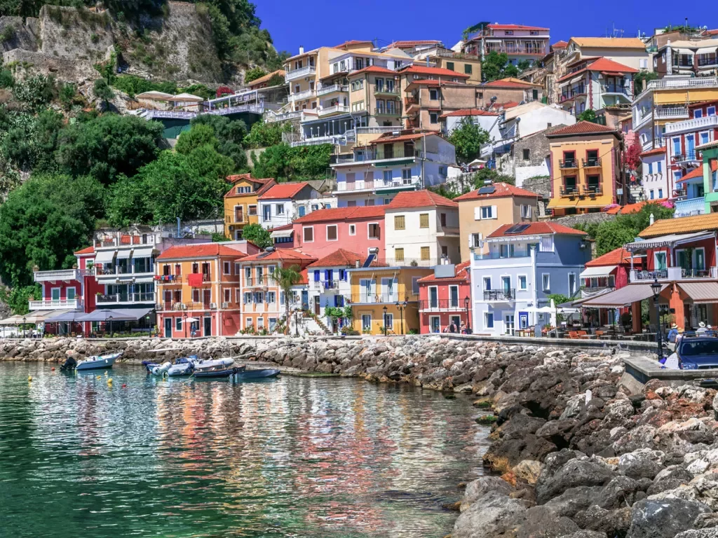 Colorful houses sitting on a rocky shore