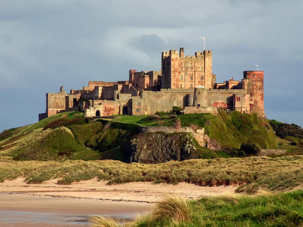 castle on a hill by a beach