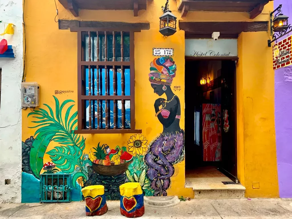 Colorful storefront with plants outside