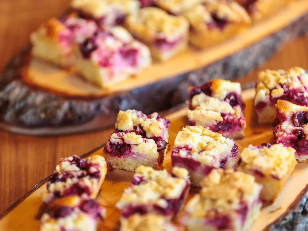 Berry pastries on a wooden plank