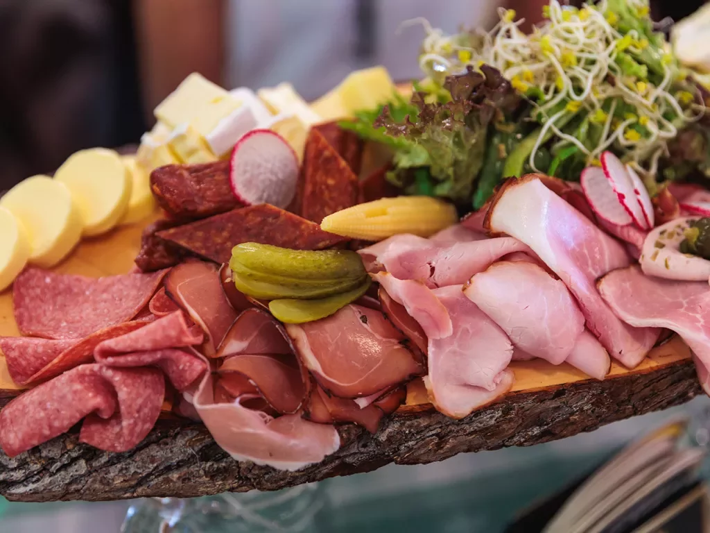 a platter of meats and cheeses