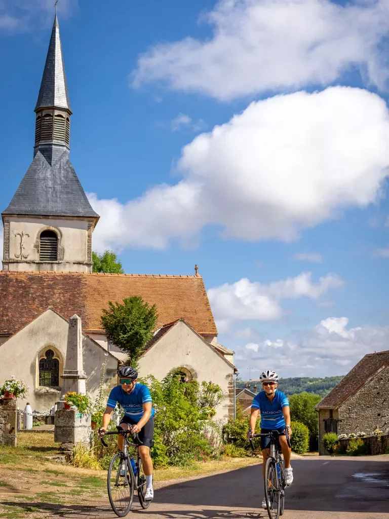 Two Backroads Guests Biking Through Town in Burgundy