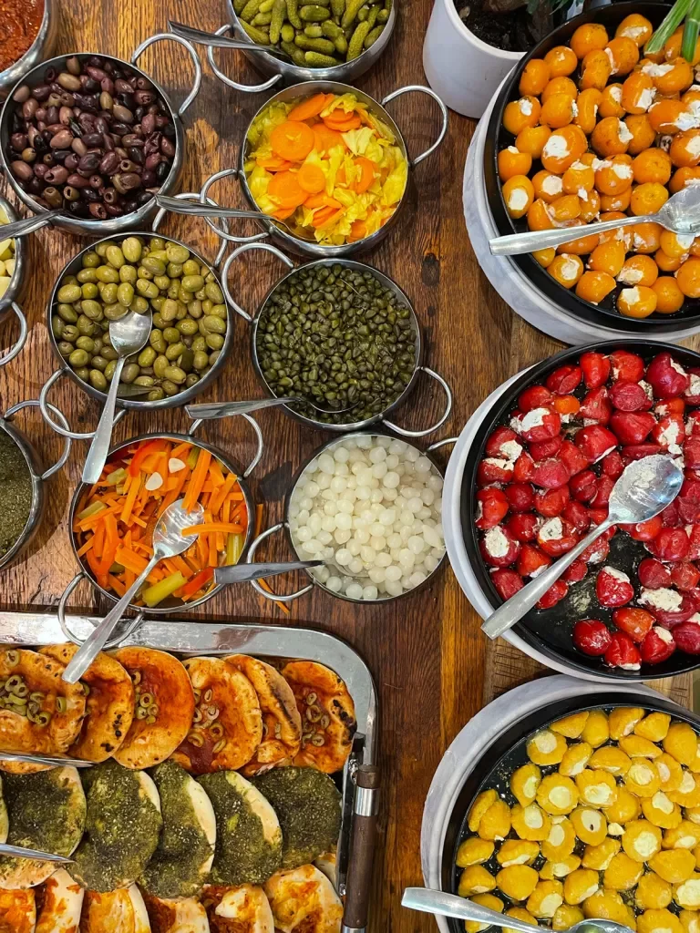Bowls full of colorful prepared foods on a table