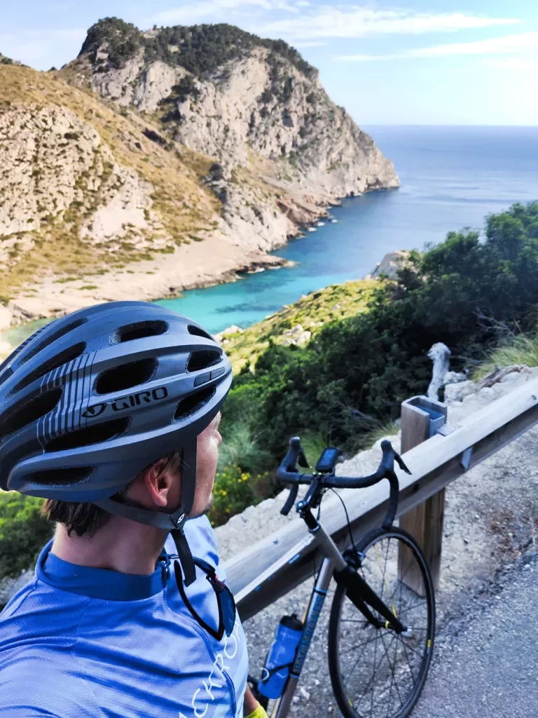 Biker taking selfie along the coast in Mallorca.